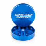 Santa Cruz Shredder blue 2-piece grinder open on a white background.