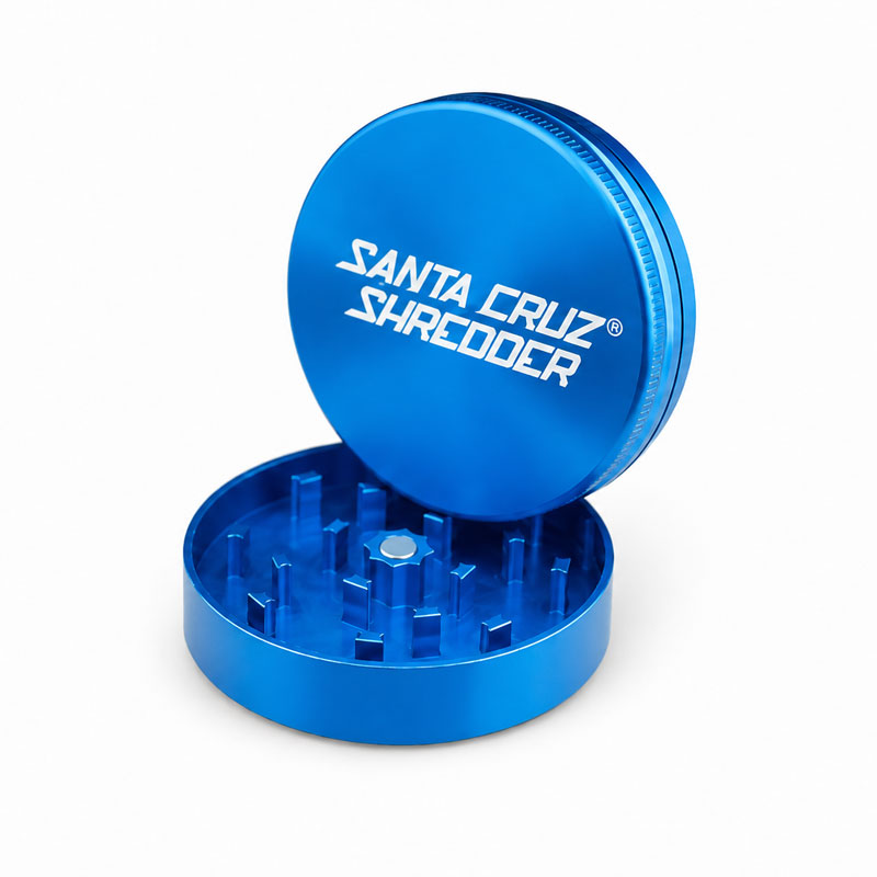 Angled blue Santa Cruz Shredder grinder with ridged grip and open chamber.