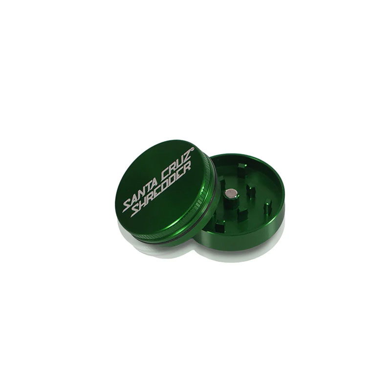Open green Santa Cruz Shredder 2-Piece Grinder Small showing teeth and magnetic lid