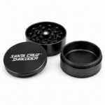 Black Santa Cruz Shredder 3-piece grinder showing the open chamber and grinding teeth.