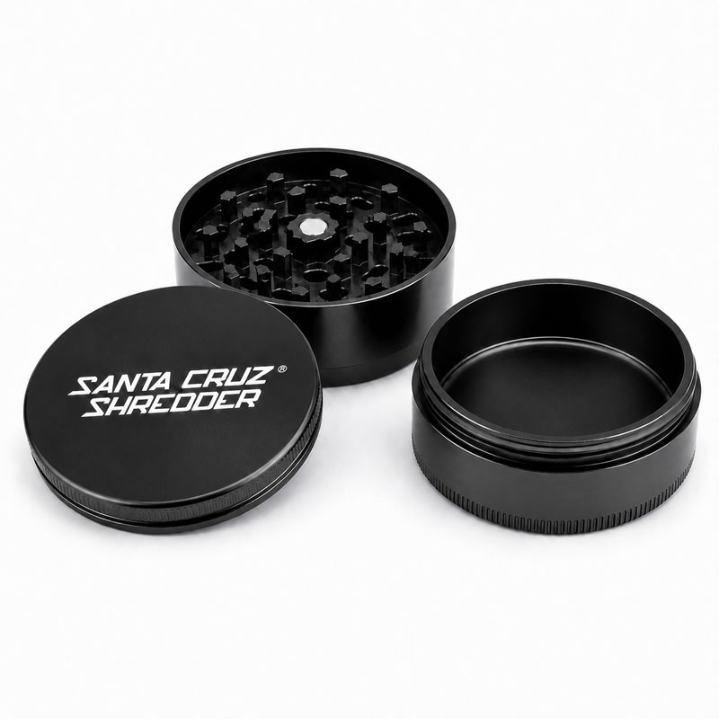 Black Santa Cruz Shredder 3-piece grinder showing the open chamber and grinding teeth.