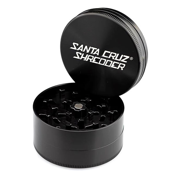 Black Santa Cruz Shredder large 3-piece grinder open with branded lid and visible teeth.
