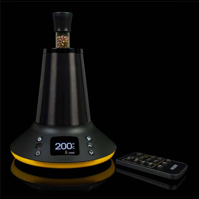 Arizer XQ2 desktop vaporizer with remote control on a dark background
