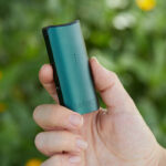 DaVinci MIQRO-C Vaporizer in green shown in hand.
