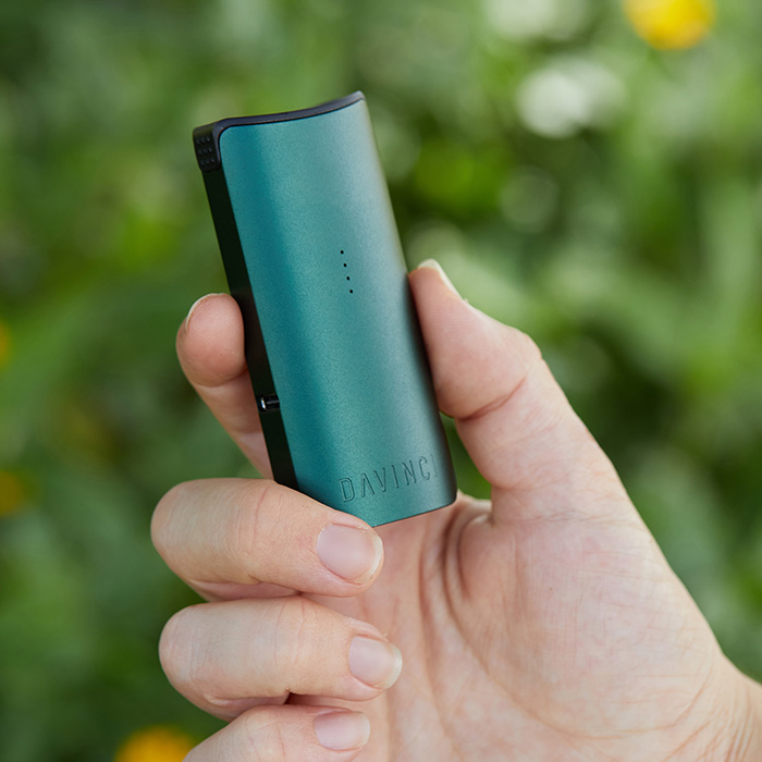 DaVinci MIQRO-C Vaporizer in green shown in hand.