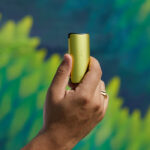 DaVinci MIQRO-C Vaporizer in yellow being held outdoors.