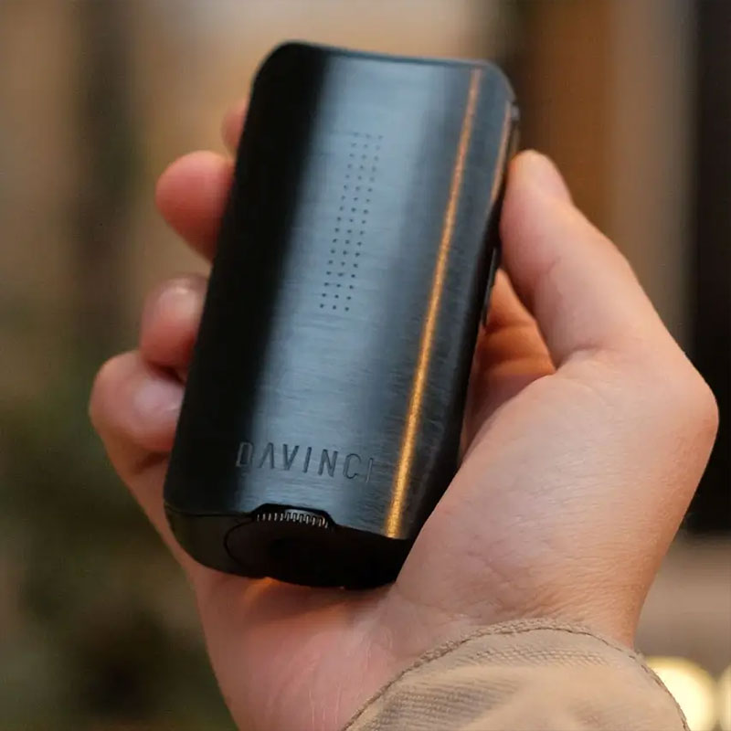 Black DaVinci IQ3 Vaporizer held in hand
