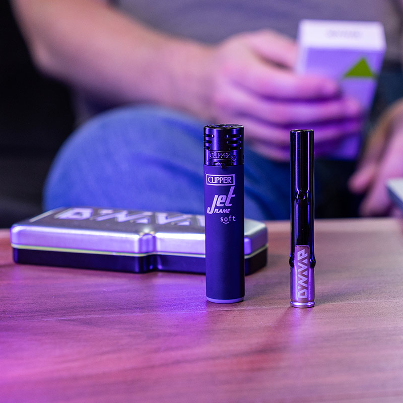 DynaVap G3 being heated with a torch lighter