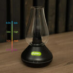 O.pen variable voltage vaporizer standing on wooden table