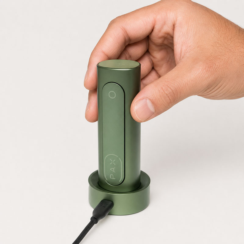Green Pax Flow charging on charging dock.