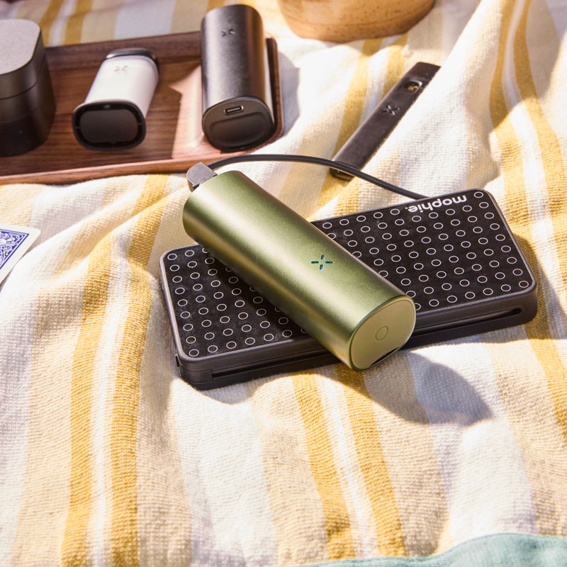 The Pax Flow on top of a phone on the table