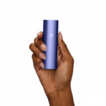 PAX Plus blue dry herb vape held in a hand
