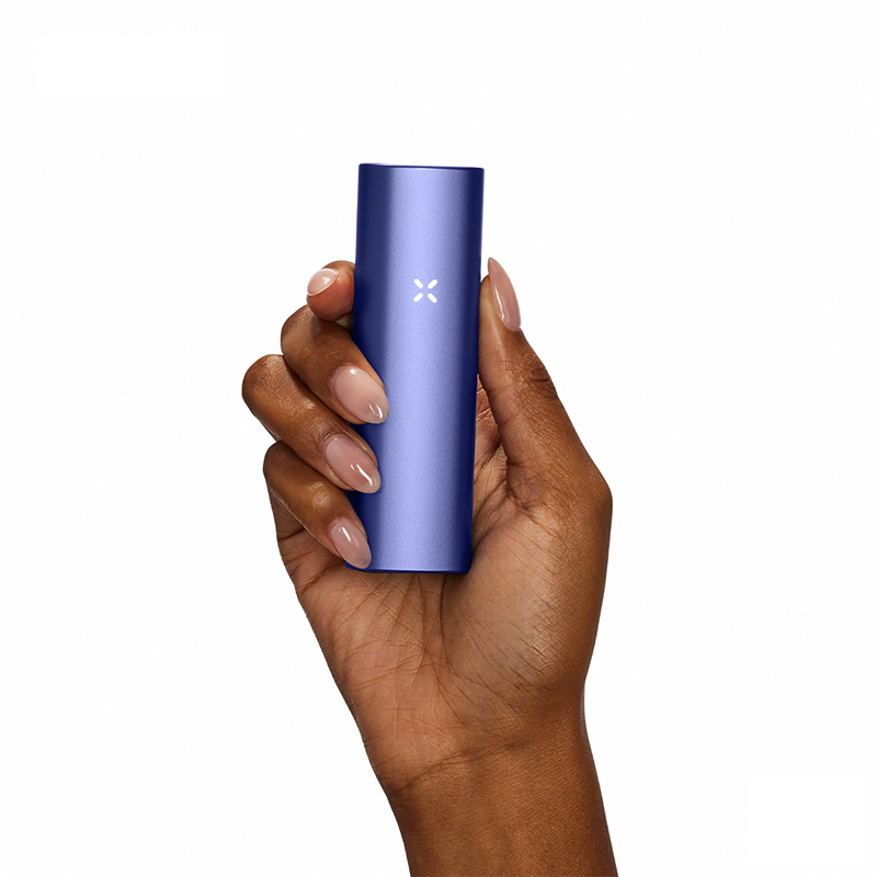 PAX Plus blue dry herb vape held in a hand