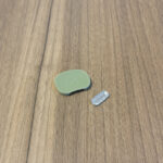 PAX Flow oven screen and mouthpiece on a wooden surface