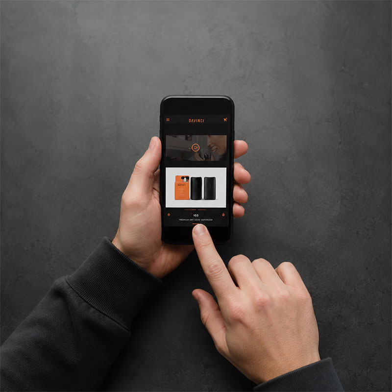 Person using the DaVinci IQ3 app on a smartphone