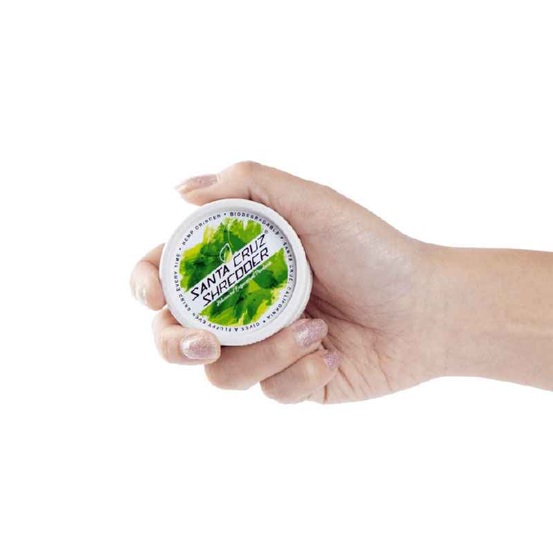 Hand holding the eco grinder with white background