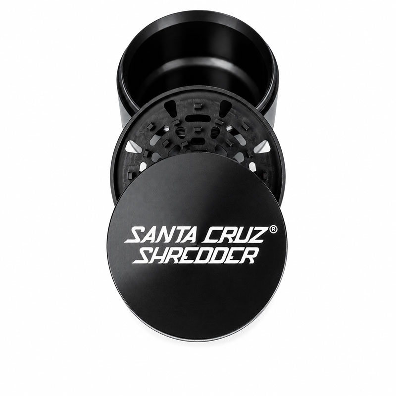 Black Santa Cruz Shredder 3-piece grinder shown open, displaying the logo lid, grinding section and chamber.