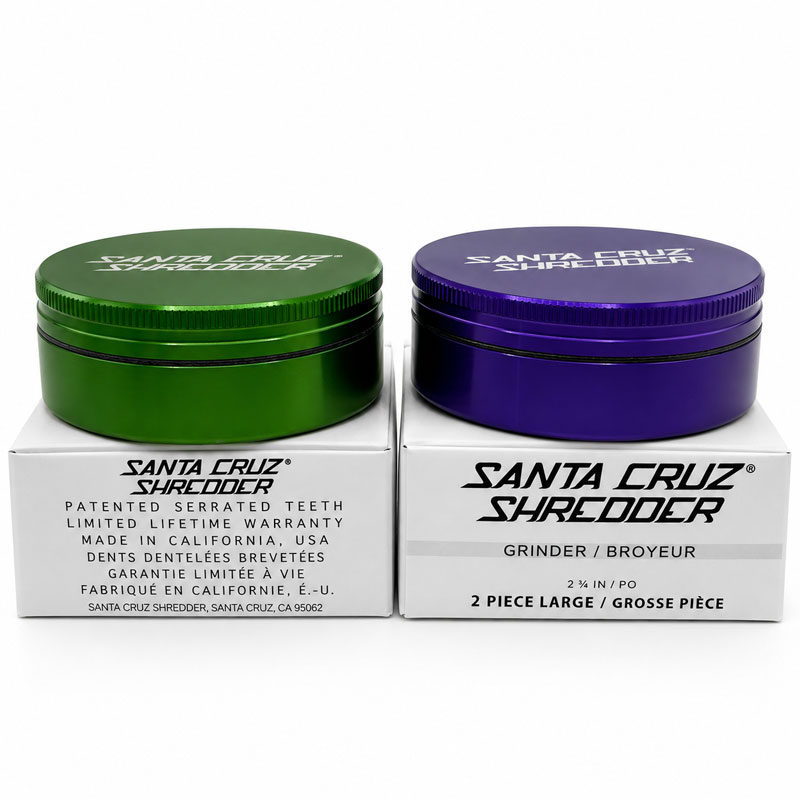 Santa Cruz Shredder 2-piece large grinders in green and purple on branded boxes.