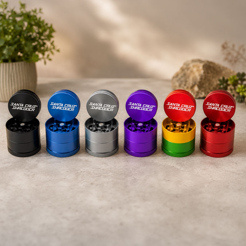 All colours of the small 3piece scs grinder indoors on a table