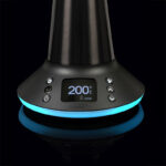 Close-up of the Arizer XQ2 vaporizer display and blue LED base light