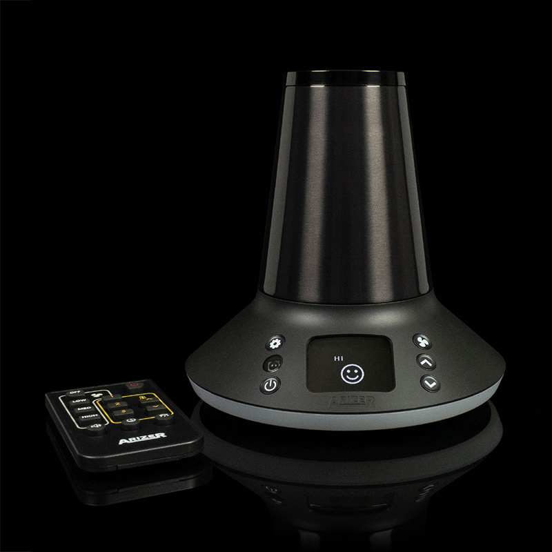 Arizer XQ2 desktop vaporizer with remote control on a black background