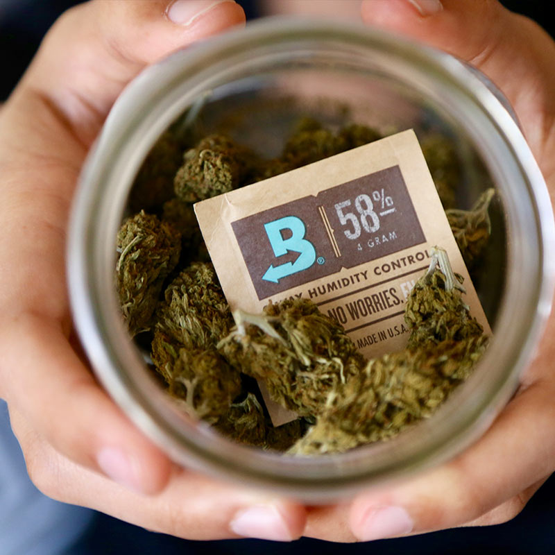 Boveda 58% humidity pack inside a jar with dried herbs