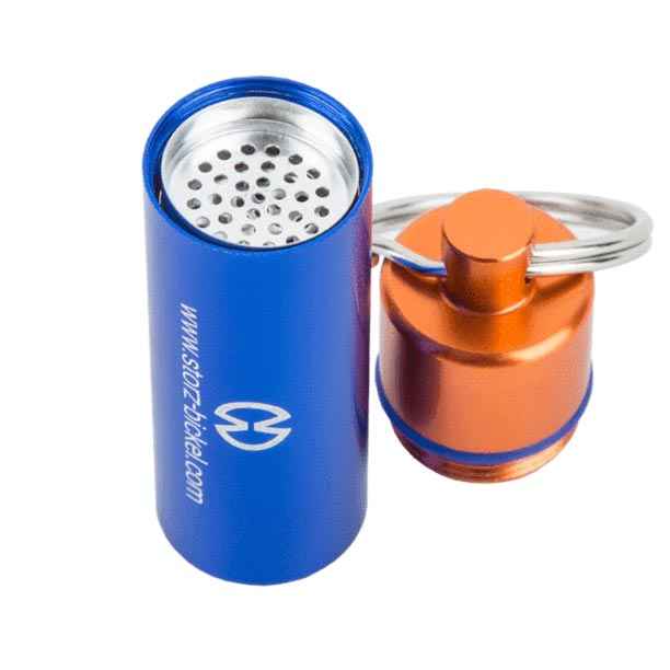 Capsule caddy opened with stored capsules