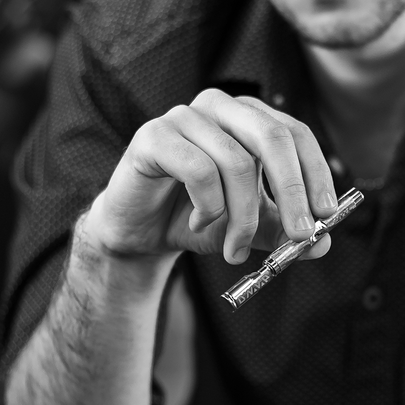 DynaVap M 7 being held for manual dry herb vaping