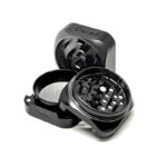 Open black Krush Kube 3.0 grinder showing tooth design