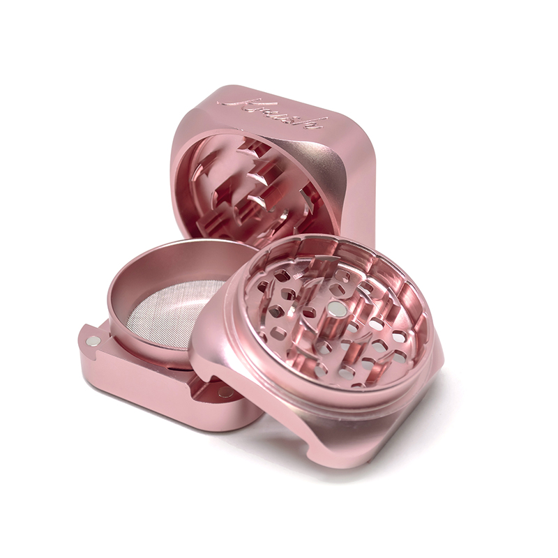 Rose gold Krush Kube 3.0 Grinder open with teeth visible