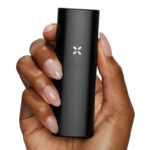 Person holding PAX Mini in Onyx finish