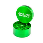 Green Santa Cruz Shredder large 3-piece grinder with raised lid and sharp teeth visible.
