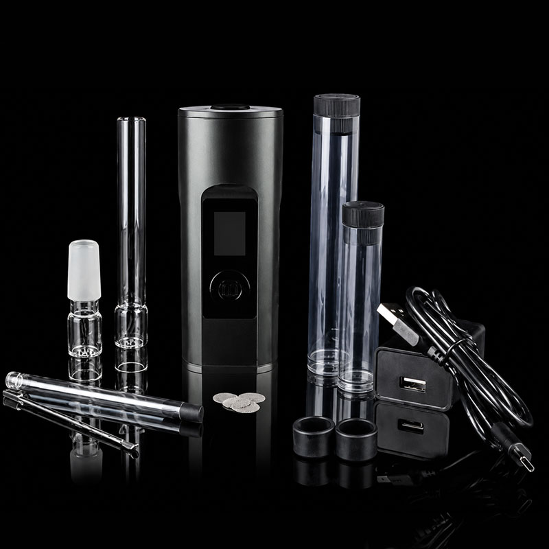 Arizer Solo 2 MAX vaporizer with glass aroma tubes, USB-C charging cable, adapters and accessories displayed on a black reflective background.
