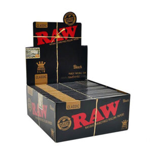 Retail display box of 50 RAW Black Kingsize Slim paper packs, ultra-thin and additive-free, crafted from natural plant fibres with iconic RAW logo.