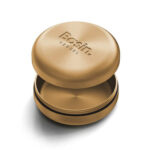Vessel Basin storage container in Gold finish featuring a precision-engineered seal and magnetic-tension lid