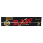 One pack of RAW Black Kingsize Slim unrefined rolling papers featuring black and gold packaging, red RAW logo, and eco-friendly natural fibre design.