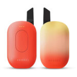 The Vessel Compass in Daybreak, featuring a rich clay-red finish and ergonomic grip