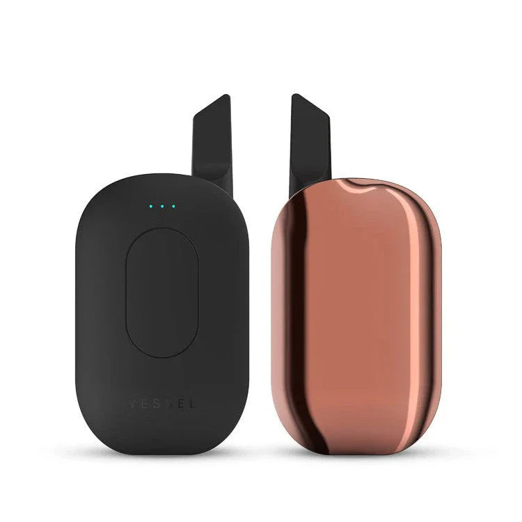 Vessel Compass 510 batteries in Black and metallic Copper finishes showing the ergonomic palm-style design