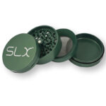 Green SLX BFG Grinder with grinding teeth and mesh screen.