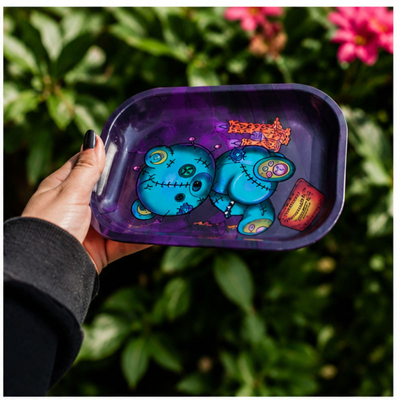 V Syndicate Ouiji Bear rolling tray held in hand outdoors