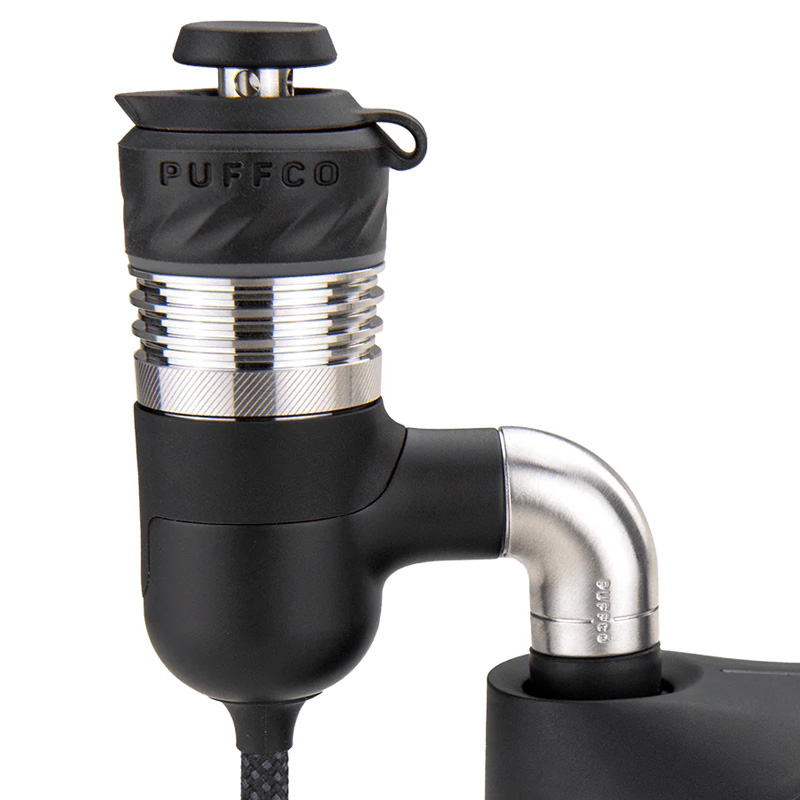 Close-up of Puffco Peak Pro adapter with metal elbow connection and black finish