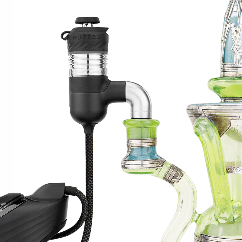 Puffco Peak Pro adapter connected to a glass rig with braided cable attached
