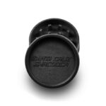 Black Santa Cruz Shredder hemp grinder opened to show grinding teeth