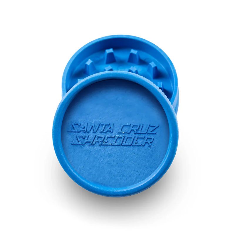 Blue Santa Cruz Shredder hemp grinder opened to show grinding teeth