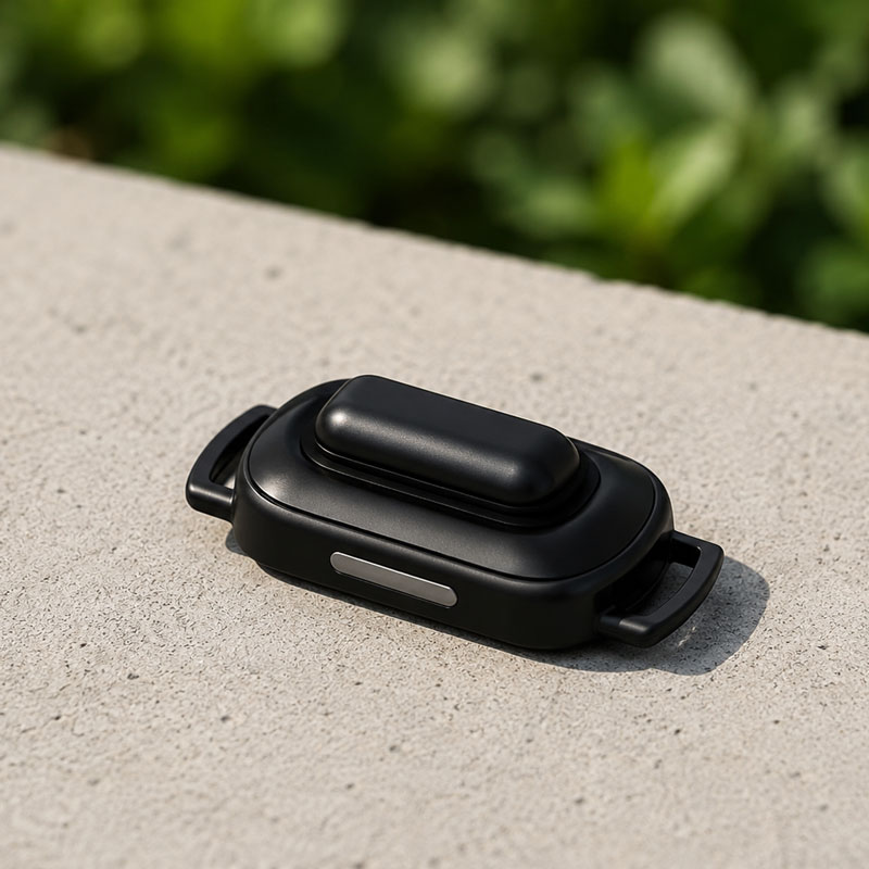 Black PAX 4 oven lid on an outdoor stone surface with blurred greenery background