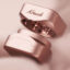 Rose Gold Krush Kube grinder opened to show the internal grinding teeth