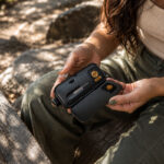 Woman holding the Pro 2 outdoors