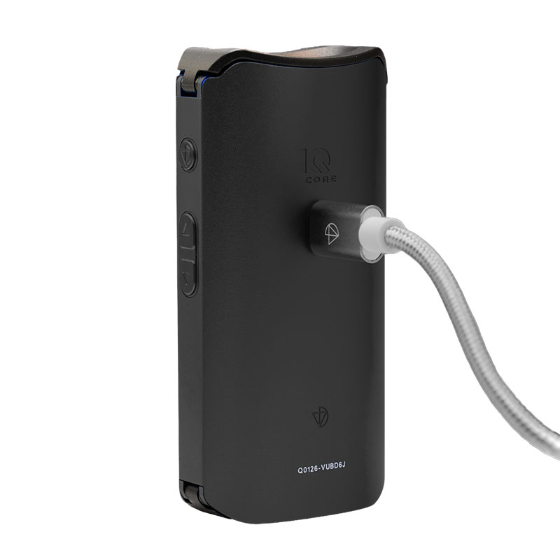 Black DaVinci IQ Core vaporizer connected to a USB-C charging cable