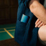 Blue DaVinci IQ Core vaporizer stored in the pocket of a dark jacket