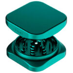 Emerald green Krush Kube 2.0 XL aluminium grinder opened to show its grinding teeth